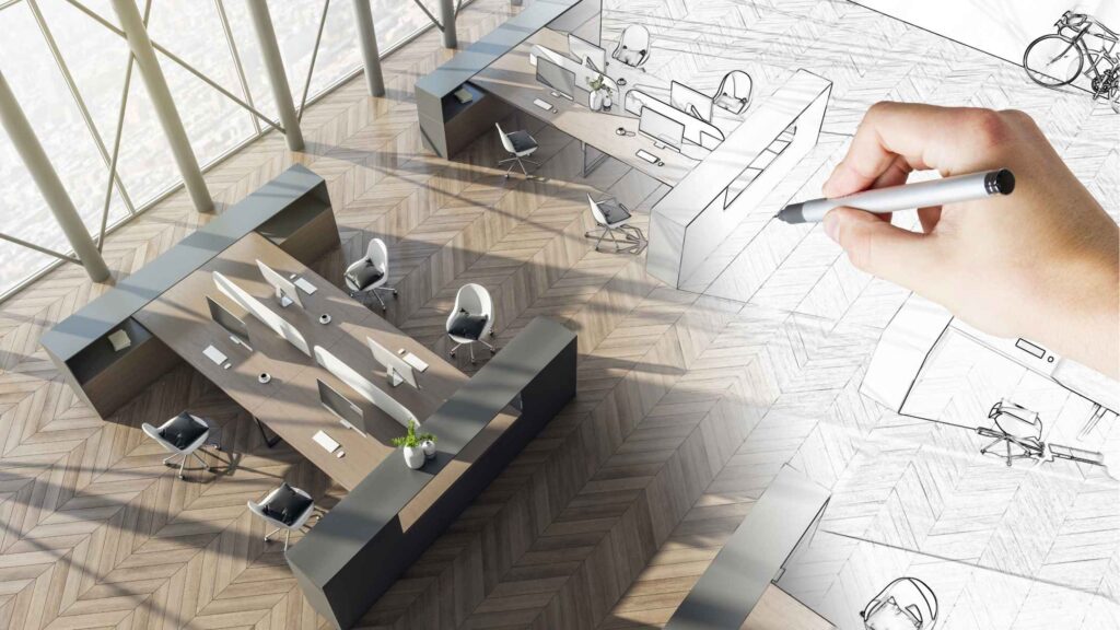 Une personne est en train de dessiner le plan d'un bureau