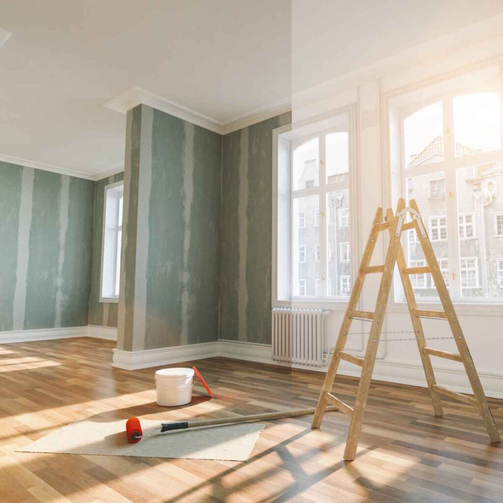 Une pièce vide avec une échelle et un pinceau